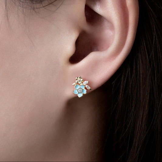 Boucles d’oreilles fleur bleu ciel en argent 925 rhodié doré – Éclat zirconium